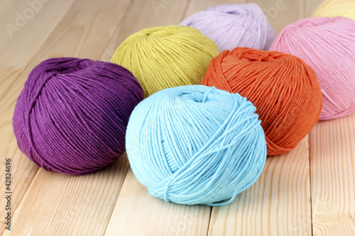 Knitting yarn on wooden background