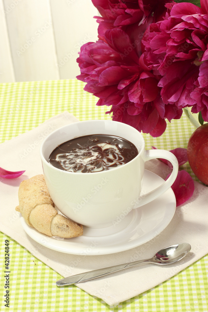 cup hot chocolate, apple, cookies and flowers on table in cafe cup hot chocolate, apple, cookies and flowers on table in cafe