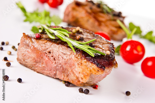 Beef steak medium grilled, isolated on white background