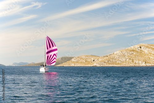 Pink yacht sailing near Croatia.