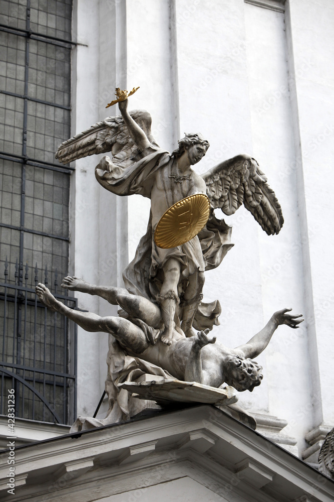 Obraz premium Saint Michael with gold shield and sword in center of Vienna