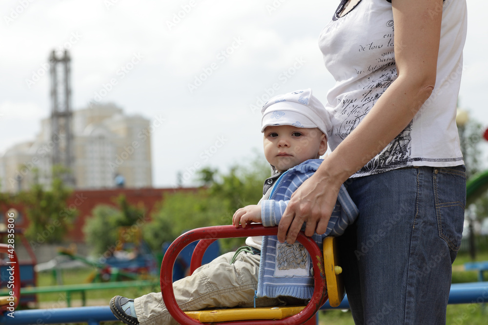Child on carousel Child on carousel