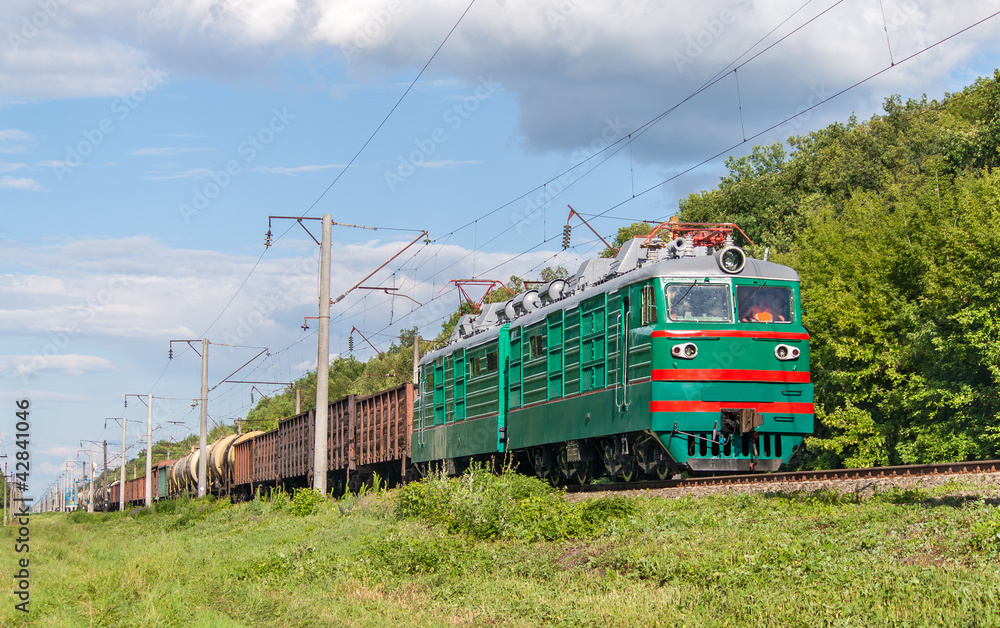 Freight train hauled by electric locomotive. Ukrainian railways