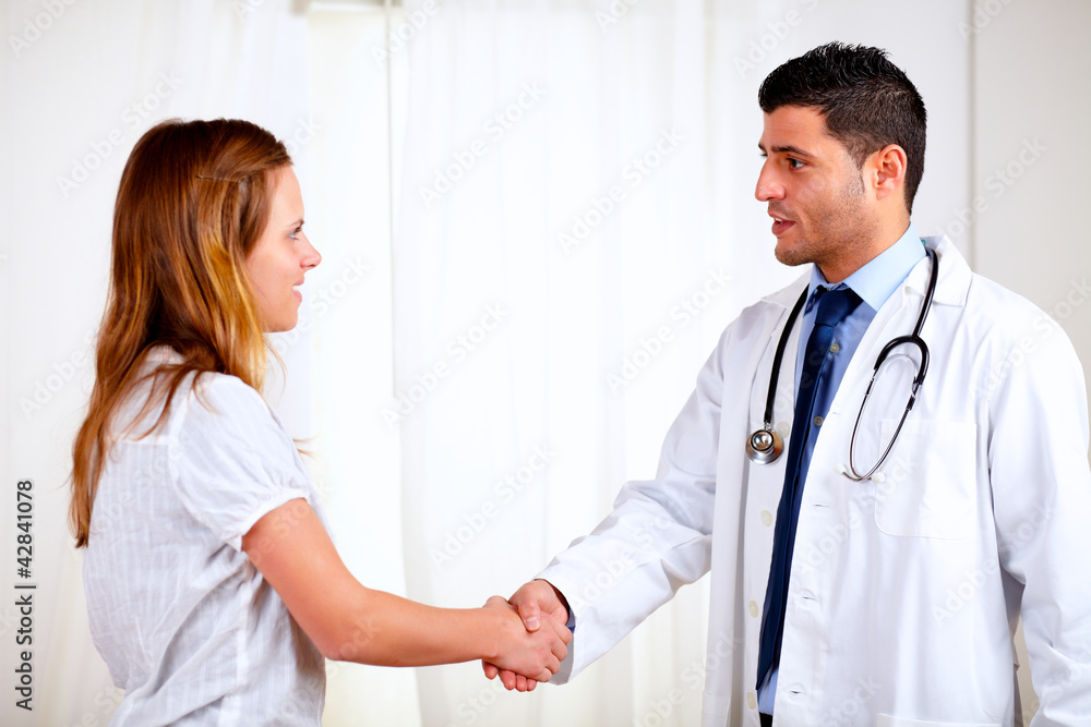 Medical specialist greeting a beautiful patient Medical specialist greeting a beautiful patient