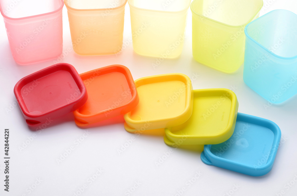 colorful plastic containers isolated on white background colorful plastic containers isolated on white background