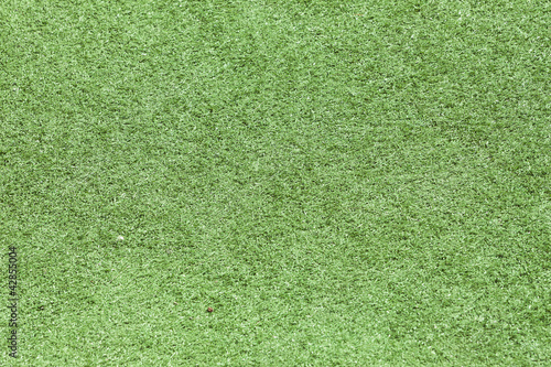Green plastic grass field top view texture