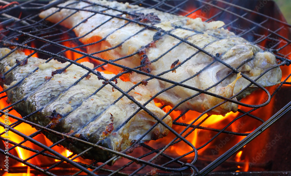 Fish on the grill. Summer barbecue concept.