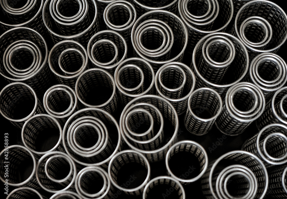 Abstract metallic curlers texture. Object over black Abstract metallic curlers texture. Object over black
