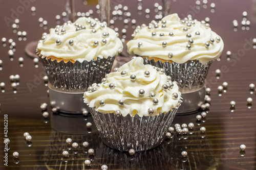 White Cupcakes with Silver Decoration