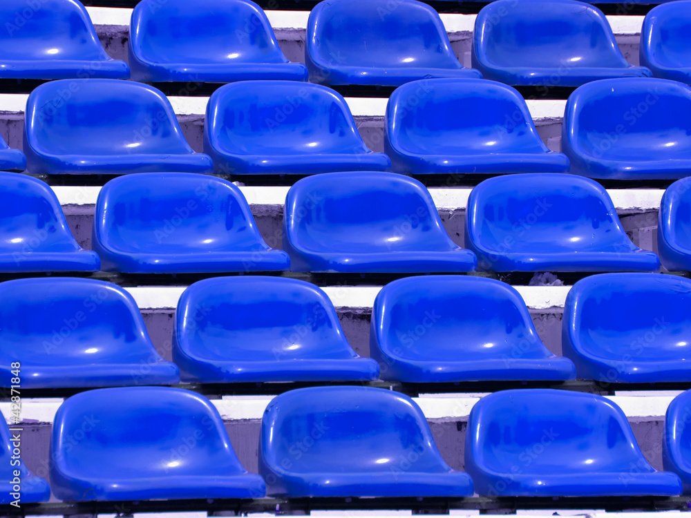regular Blue seats in a stadium regular Blue seats in a stadium