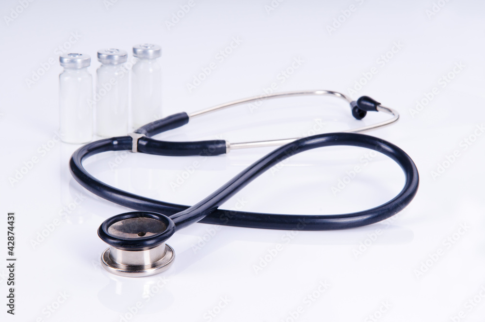 Medical stethoscope and three vials for injection Medical stethoscope and three vials for injection
