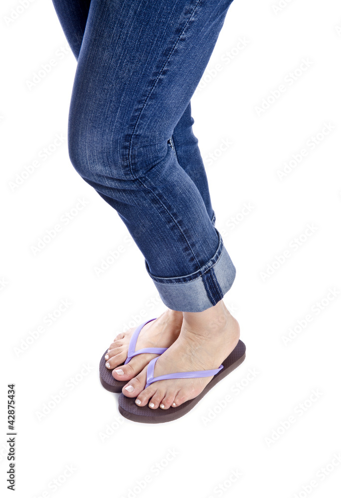 Woman Wearing Colorful Flip Flops Isolated on White Woman Wearing Colorful Flip Flops Isolated on White