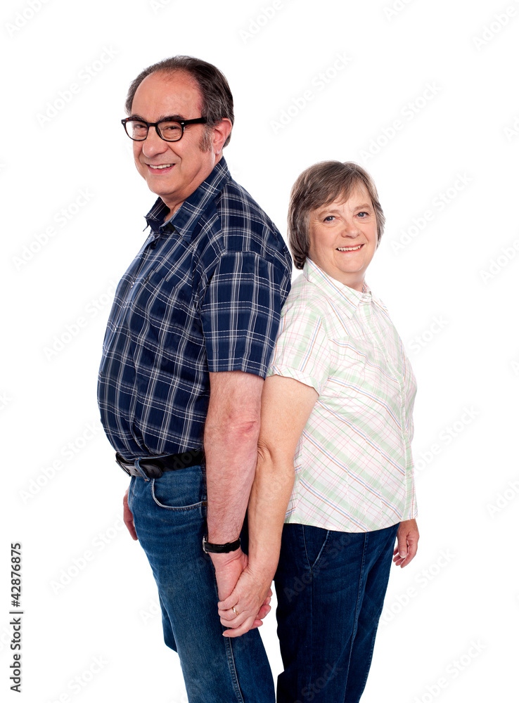 Affectionate couple posing back to back Affectionate couple posing back to back