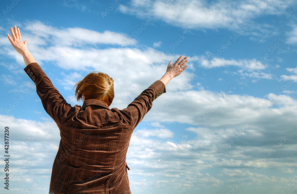 Woman with raised hands