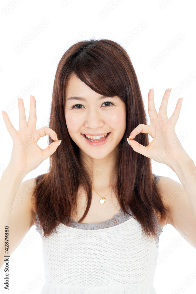 Beautiful young woman showing ok sign. Portrait of asian. Beautiful young woman showing ok sign. Portrait of asian.