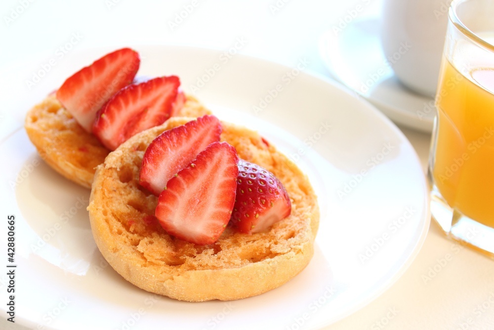 English muffin with strawberries breakfast English muffin with strawberries breakfast