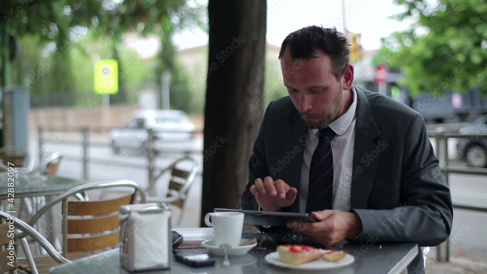Happy businessman drinking coffee in the restaurant Happy businessman drinking coffee in the restaurant