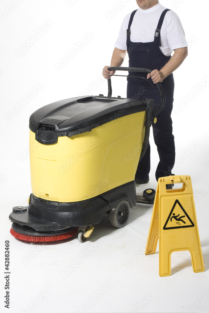 Fototapeta premium cleaning floor with machine