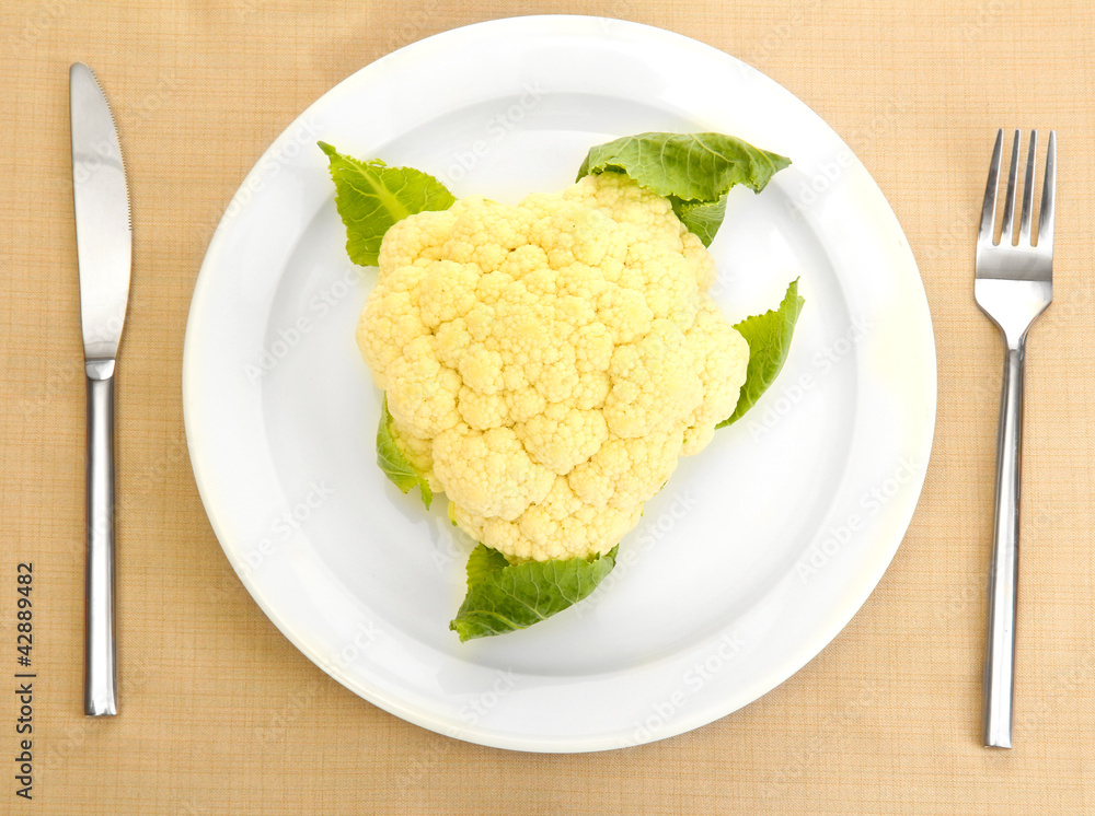 Fresh cauliflower and measuring tape Fresh cauliflower and measuring tape