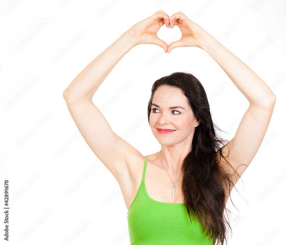 Beautiful woman forming love heart with hands Beautiful woman forming love heart with hands
