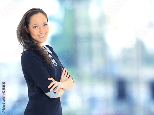 Free Download A portrait of a young business woman in an office - GFXLoad