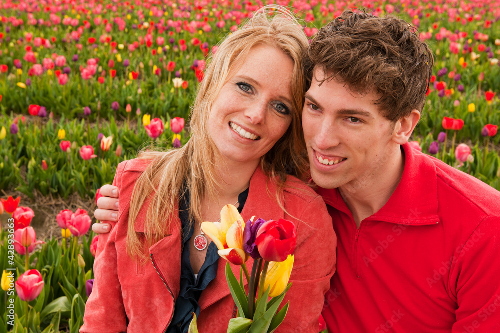 Young love couple in Dutch flower fields