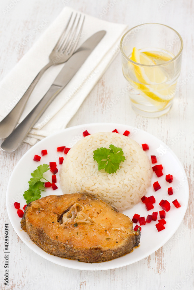 fish with boiled rice on the white plate fish with boiled rice on the white plate