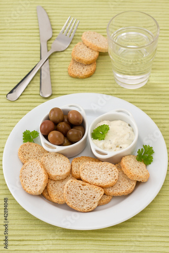 Fototapeta Naklejka Na Ścianę i Meble -  toasts with olives and sauce