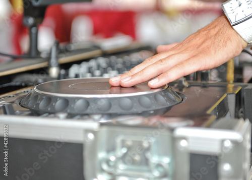 Working Disc jockey at party. Detail of a dj hands.