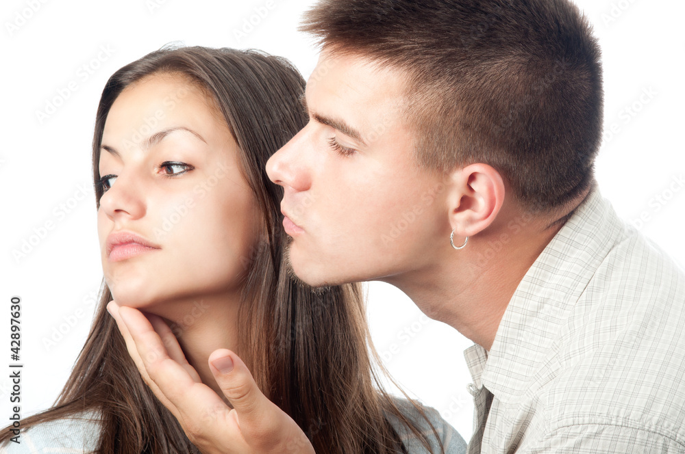 Angry woman rejects her boyfriend isolated on white Angry woman rejects her boyfriend isolated on white