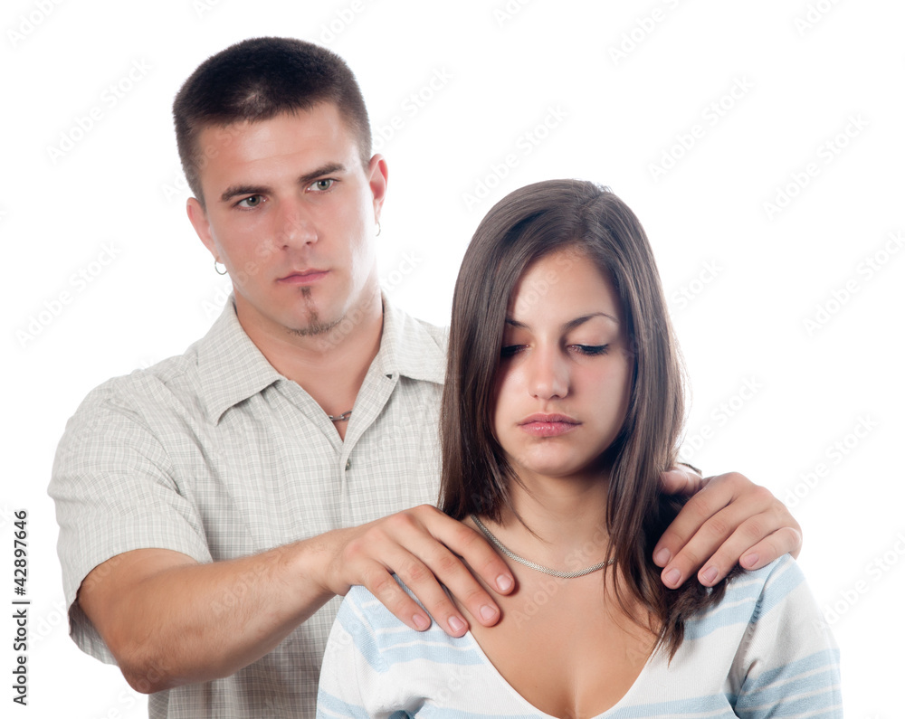 Man consoling his sad girlfriend isolated on white Man consoling his sad girlfriend isolated on white