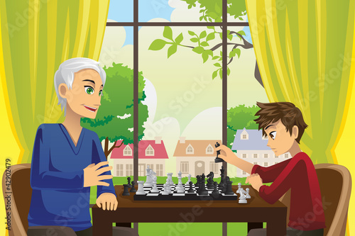 Grandfather and grandson playing chess