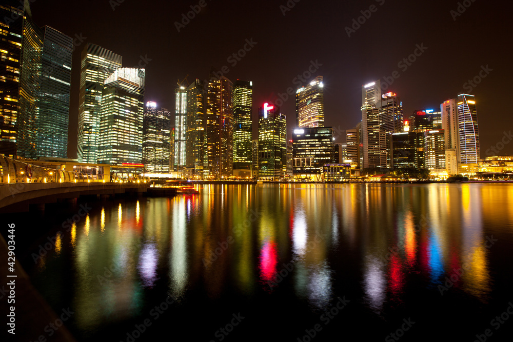 Singapore in the night time with water reflections