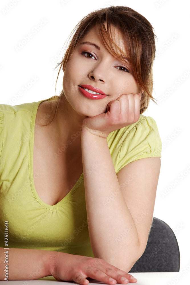 Young woman sitting at the desk Young woman sitting at the desk