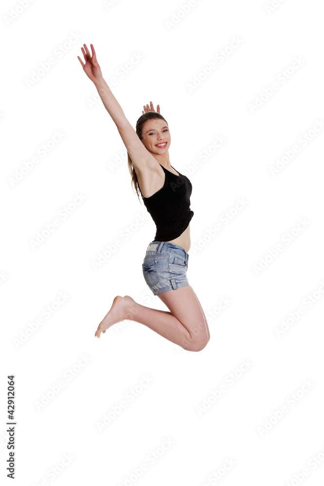 Teen girl jumping for joy