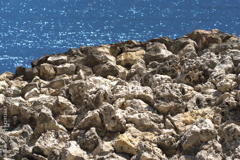 Landscape with stones coast and sea at far