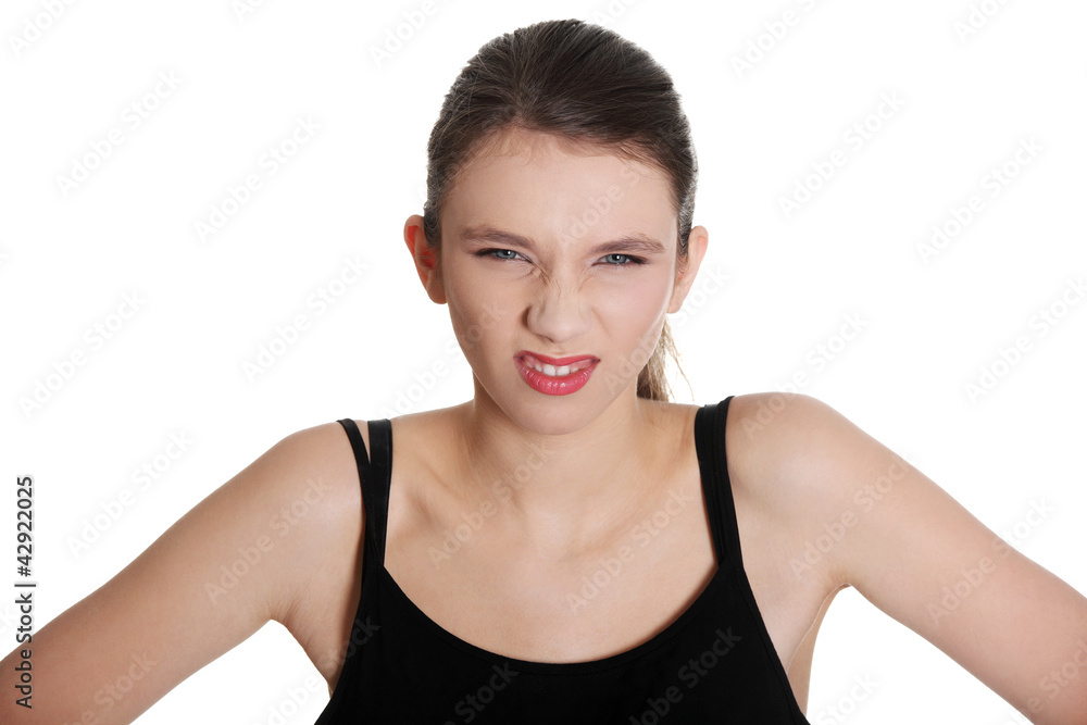 Young woman wrinkling nose and squinting eyes. Young woman wrinkling nose and squinting eyes.
