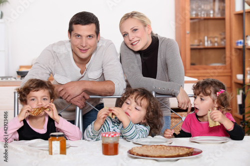 Young family having breakfast