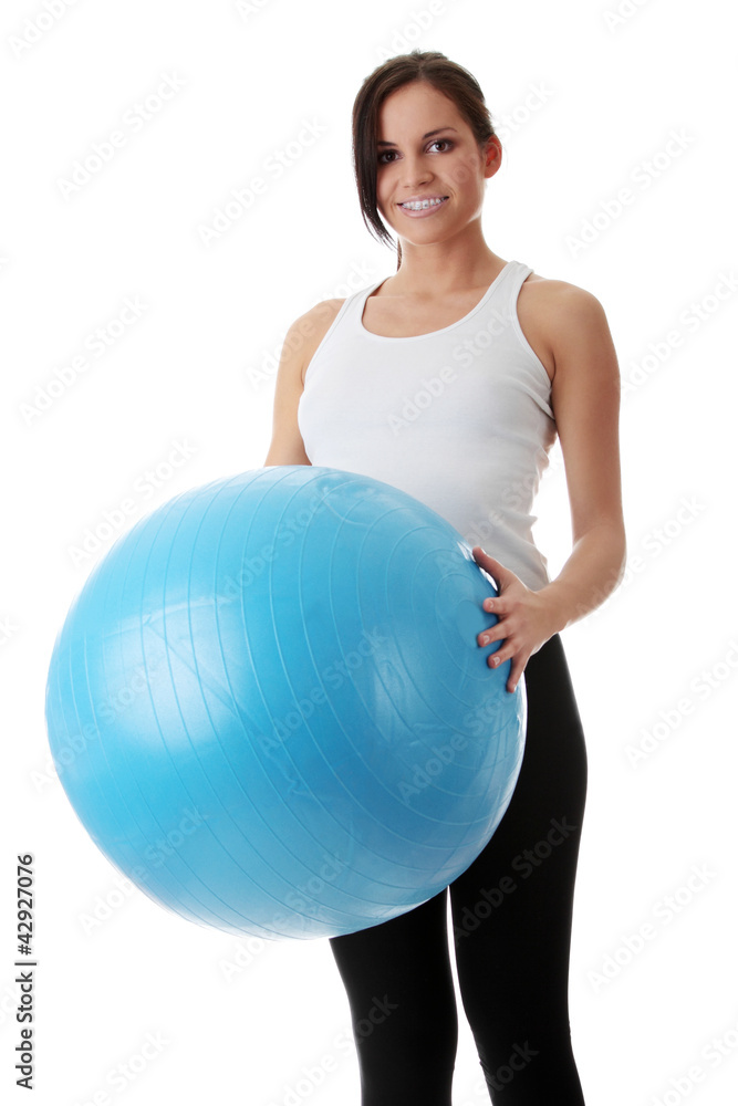 Young woman holding fitness ball with smile Young woman holding fitness ball with smile