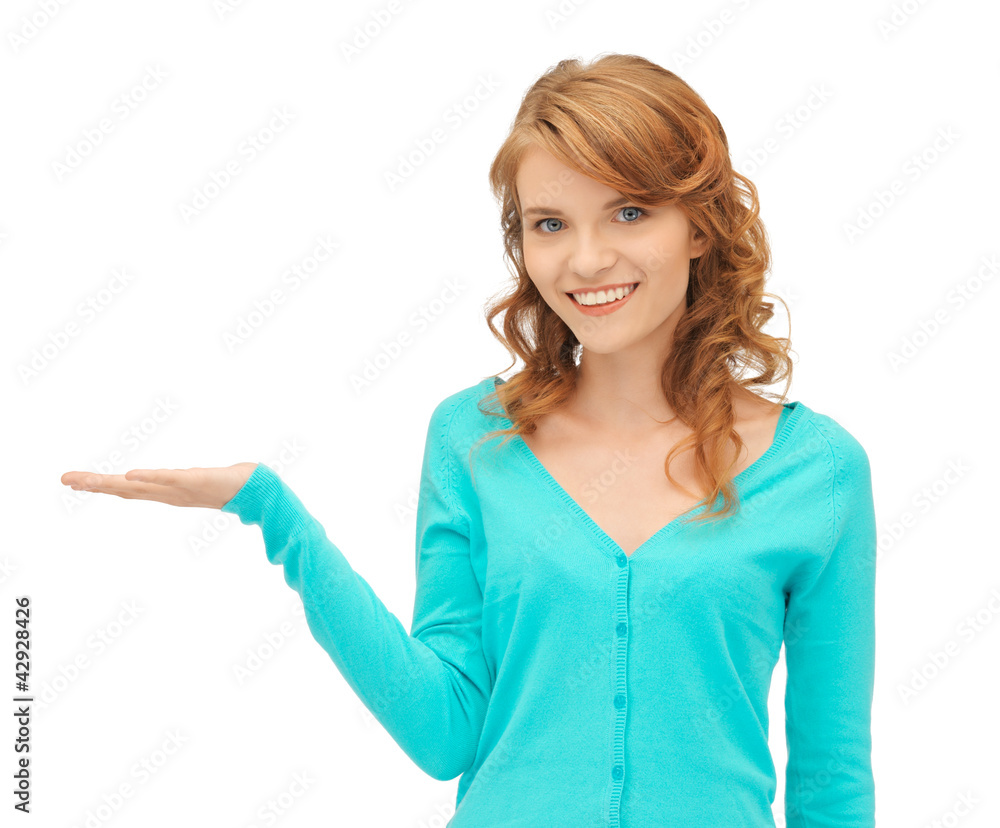 girl showing something on the palm of her hand girl showing something on the palm of her hand