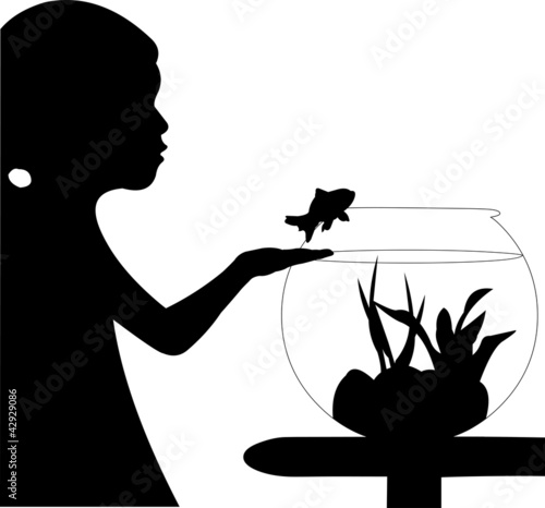 Cute small girl returning fish back into the aquarium silhouette