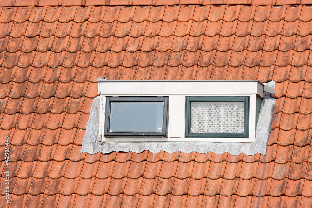 Typical Dutch roof with dormer and squared windows Typical Dutch roof with dormer and squared windows