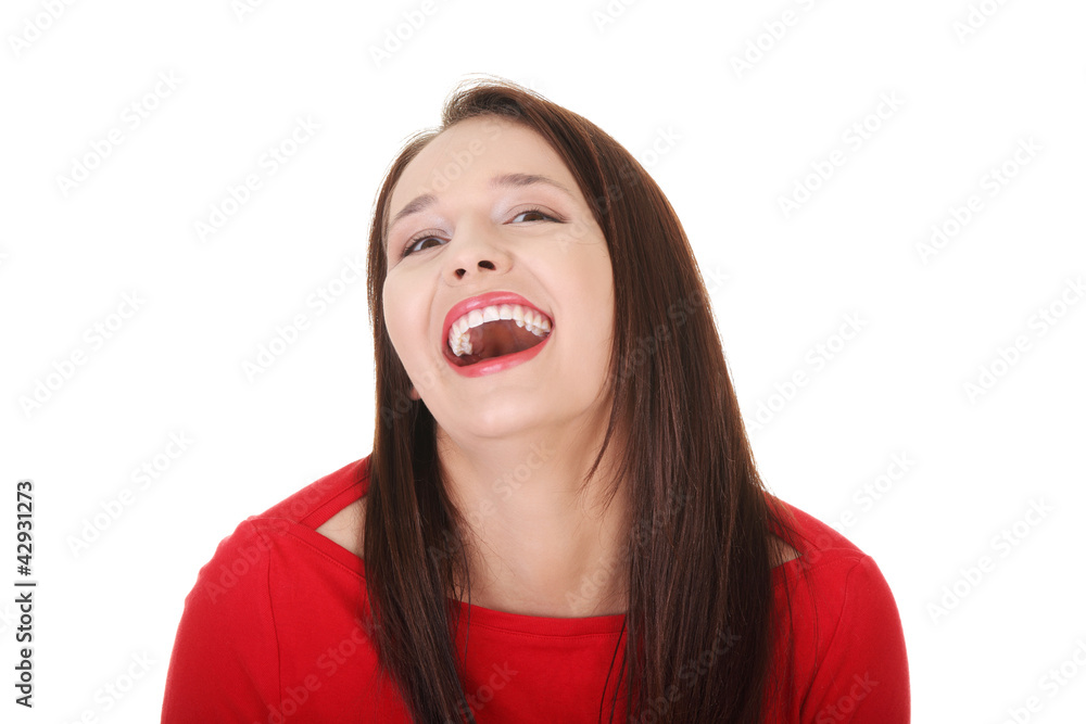 Young happy woman wearing red blouse is laughing. Young happy woman wearing red blouse is laughing.