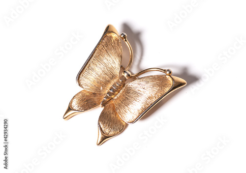 Gold butterfly pendant on white