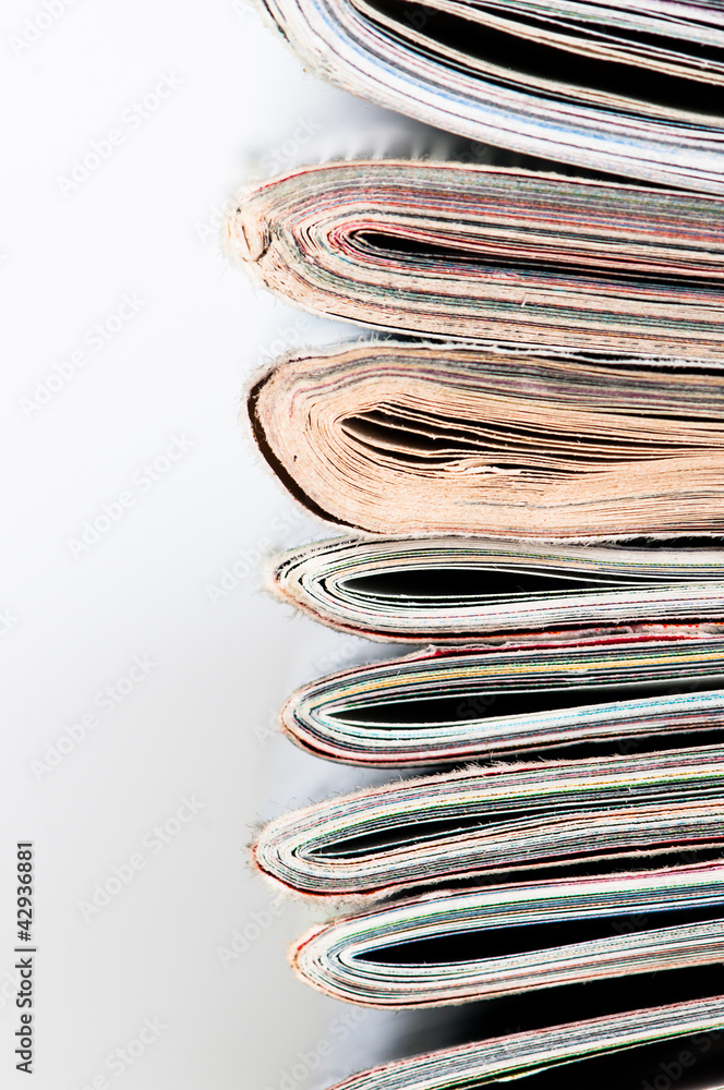 A large stack of magazines piled high.