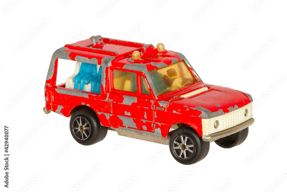 Old toy car (red security car, 1970) isolated on white
