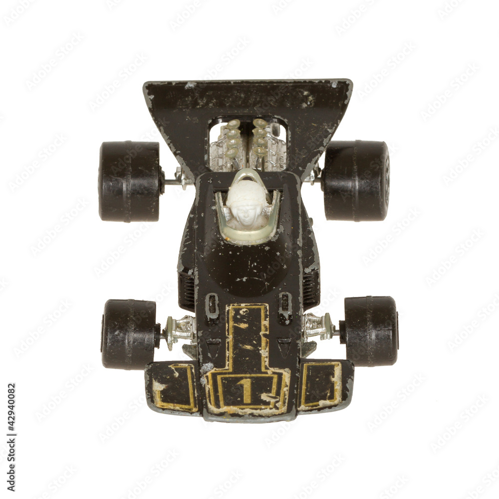 Old toy car (V8 racer, 1970) isolated on white Old toy car (V8 racer, 1970) isolated on white