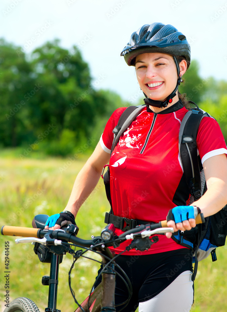 Happy Young Woman riding bicycle outside. Healthy Lifestyle Happy Young Woman riding bicycle outside. Healthy Lifestyle
