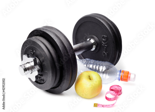 Dumbbells, apples, a bottle and centimeter isolated on white bac
