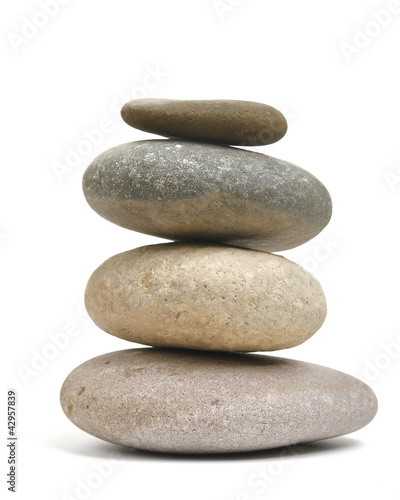Balancing rocks isolated against white background